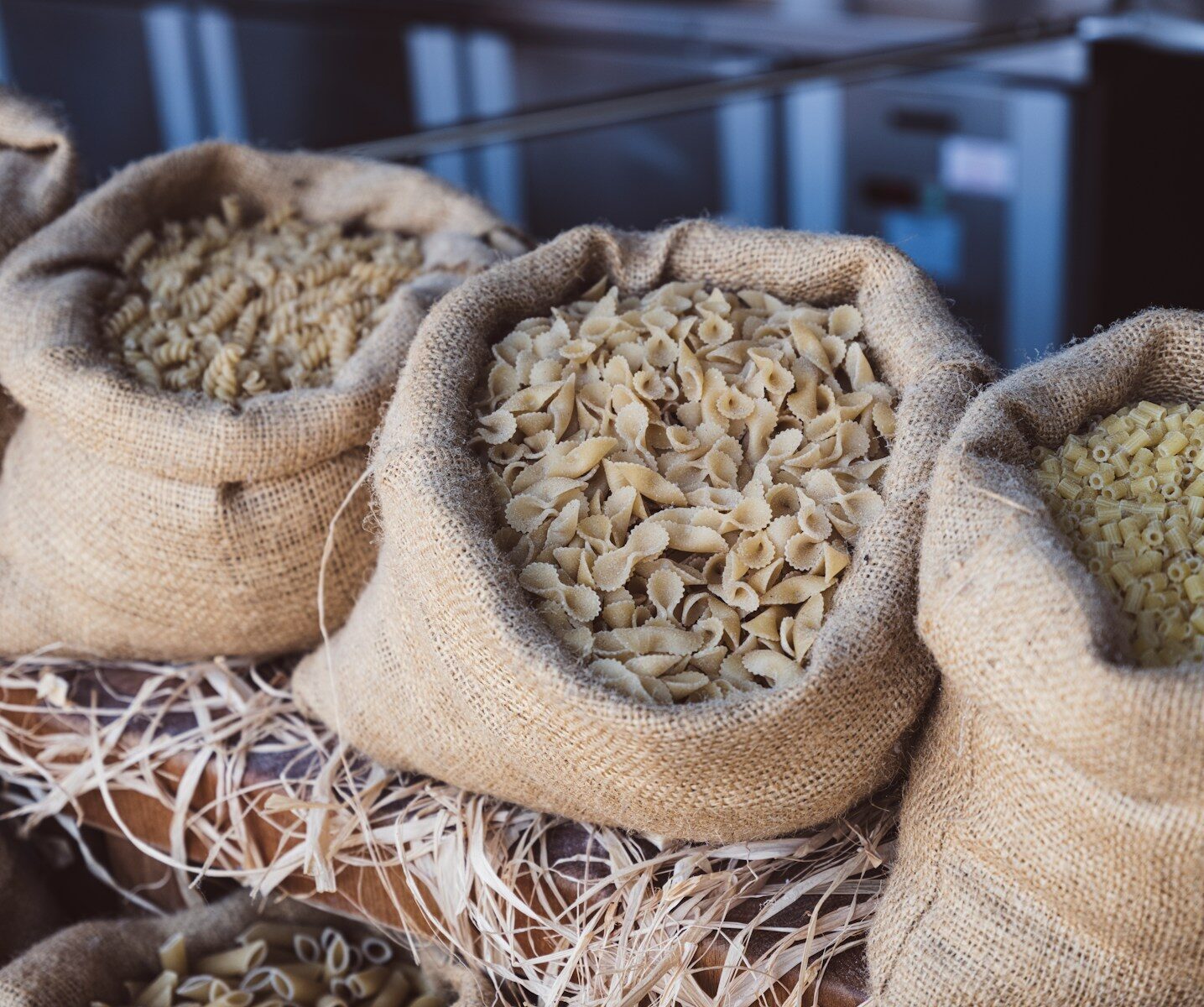 Bags of different types of pasta.
